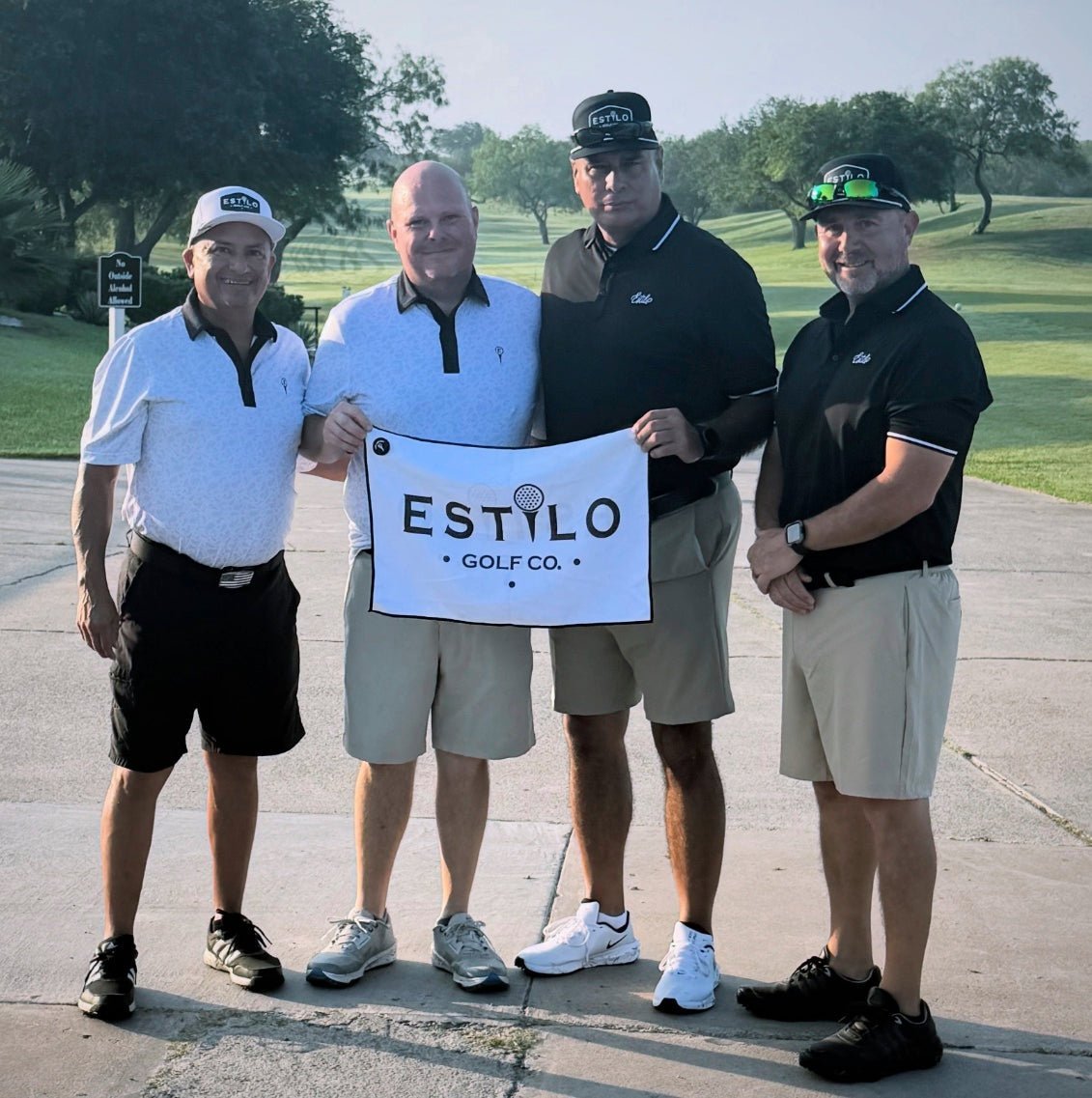 Estilo customers holding a golf towel on the course