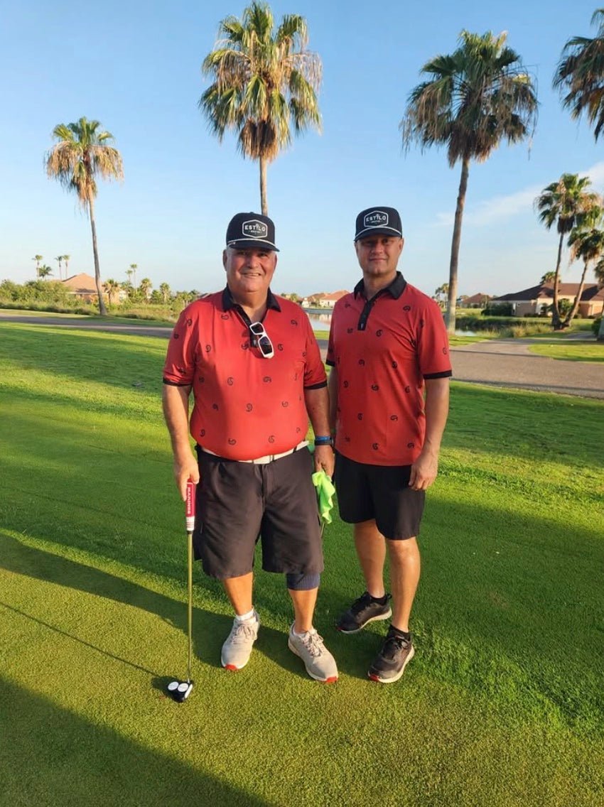 Estilo customers wearing red polos and hats on a golf course